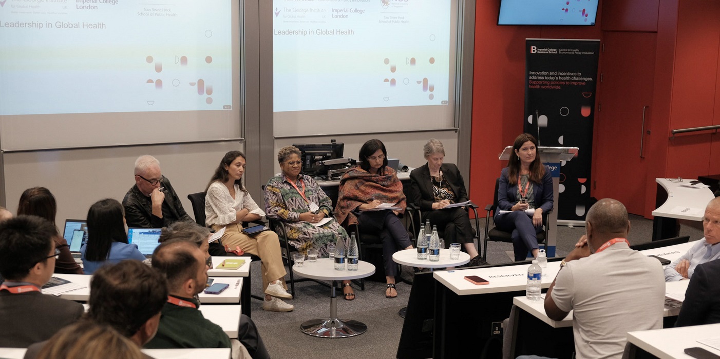 Photo of lecture theatre with panellists seated at front 