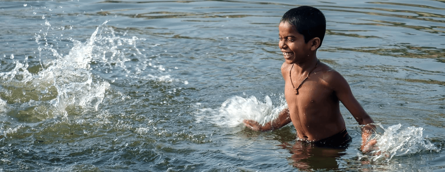 Boy splashing in the water