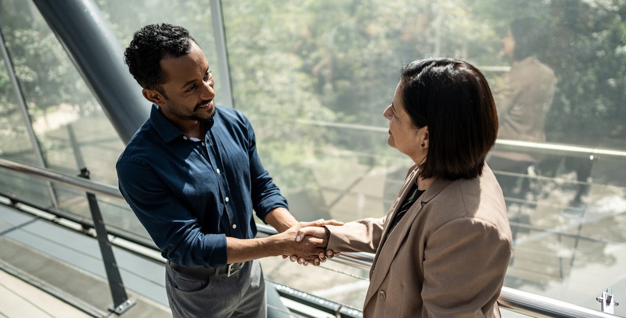 Man and woman shaking hands