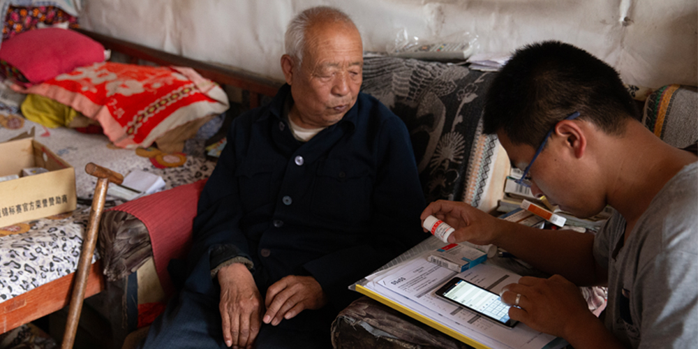 A George Institute China Researcher working with a patient during the SSaSS Clinical trial in Changzhi Province China