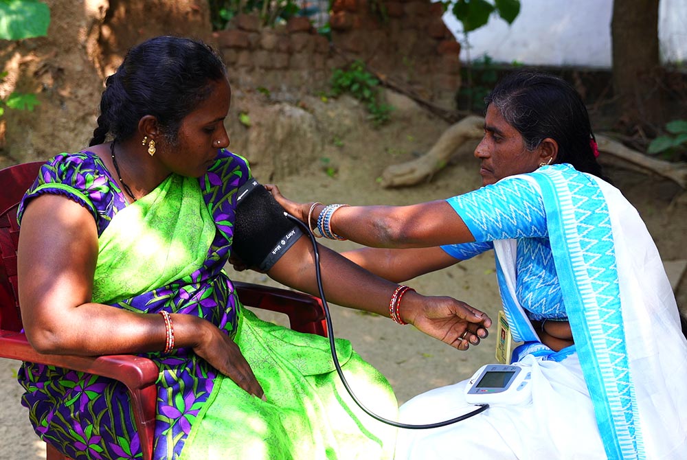 Sravanthi getting her blood pressure checked